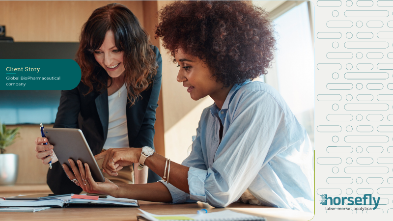 Image shows two women looking at a tablet