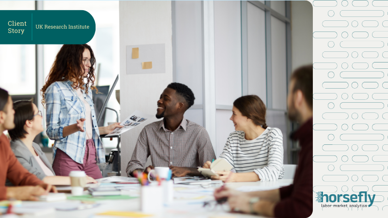 Image shows a group of people happily working together in discussion at a desk for the blog, Early Careers Evolution: How Horsefly Transformed University Recruitment Strategy for a UK Research Institute