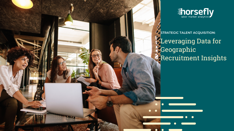 Image shows a team gathered around a desk with laptop and paperwork having a discussion for the blog - Strategic Talent Acquisition: Leveraging Data for Geographic Recruitment Insights