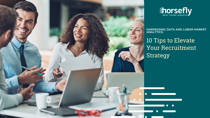 Image shows a group of workers working around a laptop for the blog - Harnessing Data and Labor Market Analytics: 10 Tips to Elevate Your Recruitment Strategy